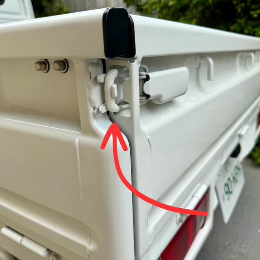 White Honda Acty Kei Truck Bed Latch Protectors on rear latch